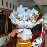 Jual Buket Bunga Mawar Ungu 3 Tangkai Untuk Kado ke Pacar kirim area Purwokerto